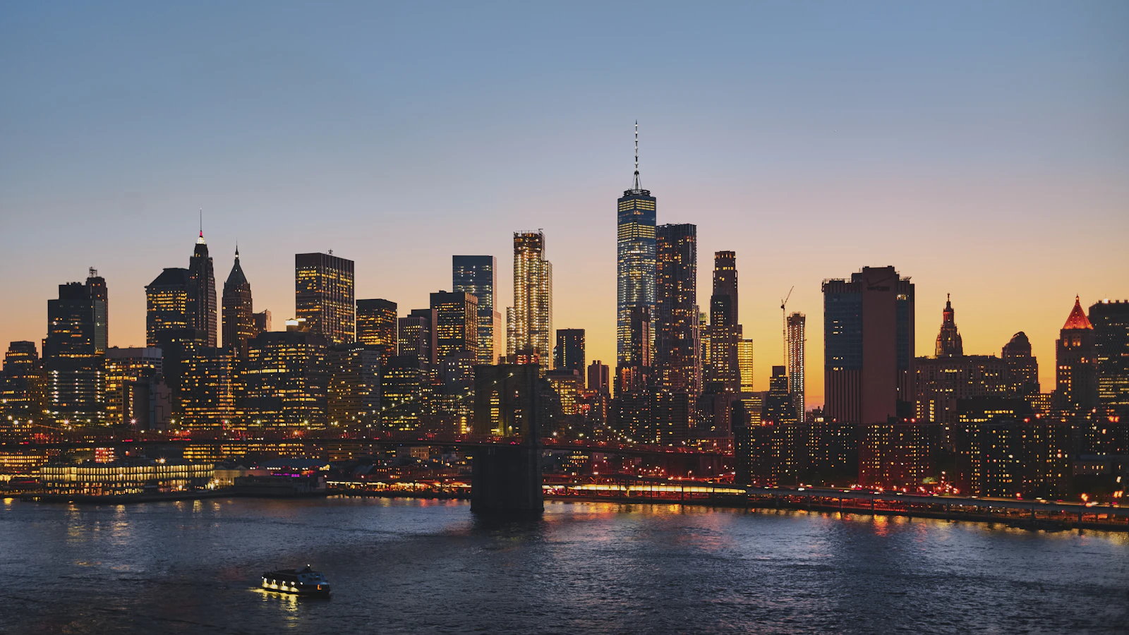 The Manhattan skyline and Brooklyn Bridge at dusk